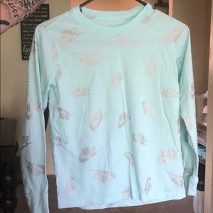 Light blue Nike girls shirt. Size L.